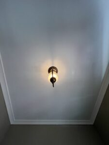 Residential painter in Jackson Michigan finishing interior wall