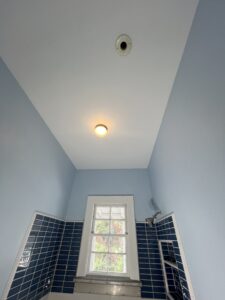 Residential painter in Jackson Michigan finishing interior wall