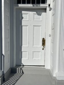 Residential painter in Jackson Michigan exterior door painting and finishing