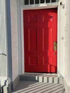 Residential painter in Jackson Michigan exterior door painting and finishing
